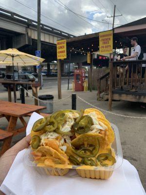 Crawfish nachos topped with crab and jalapeños.