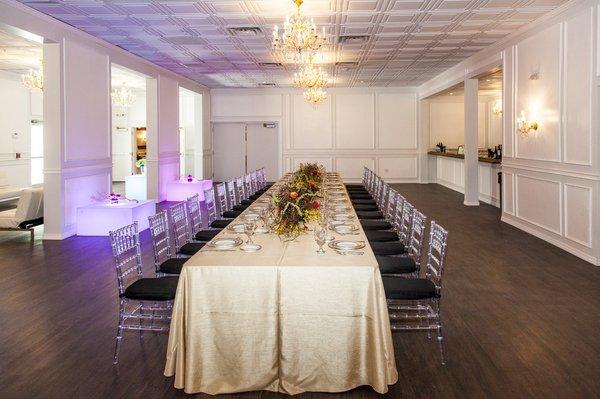 The Amanda room: Hardwood floors, neutral walls, and a touch of old world brick. The room can accommodate 165 people for a sit-down dinner