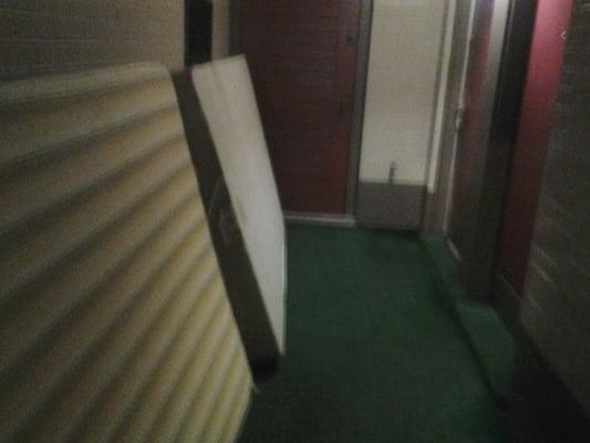 Old mattresses stacked in Hallway