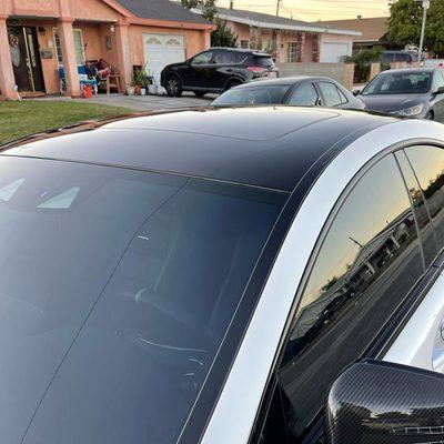 CLS63s AMG Roof wrap, roof rails, and Window trims done in Avery Gloss black