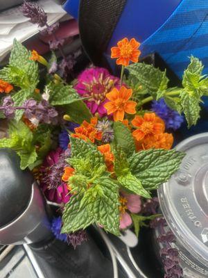 Pretty bouquet in my cupholder on the way home. Created with mint and basil so it smells good too.