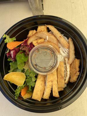 Seasonal (winter) noodles (spring mix salad with rice noodles, tofu, carrots, and imitation meat and a soy lemon sauce)