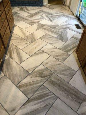 Herringbone style ceramic tile.