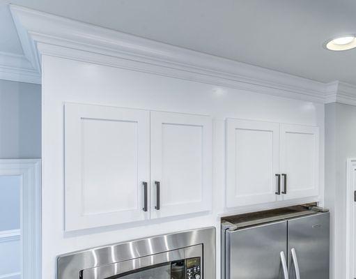 Cabinet doors were replaced. Cabinet boxes are refaced. Cabinets boxes were extended to the ceiling.