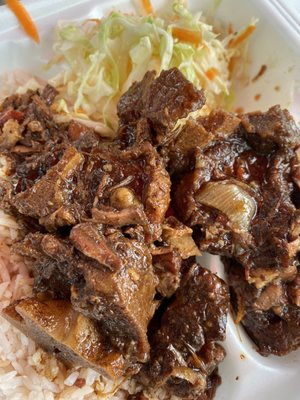 oxtail, served over rice & beans with slaw - medium