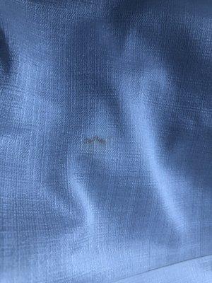 The stain they caused while fixing my zipper on my white dress.