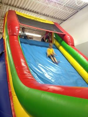 Bounce houses, slides, obstacles course, little zip line.