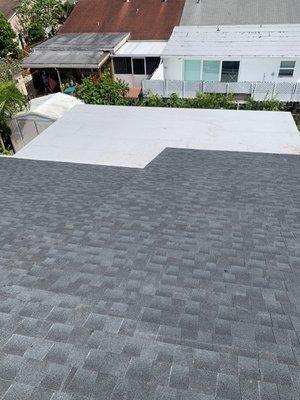 Charcoal shingle and flat roof