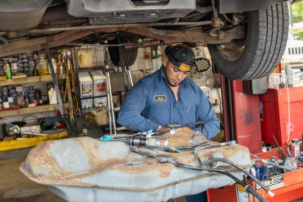 Technician working on vehicle