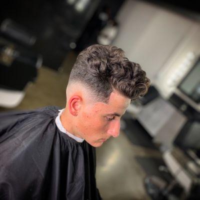 Drop fade with curls on top