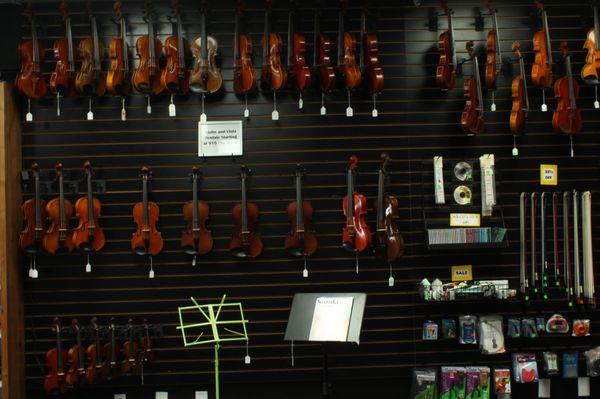 Come see our huge display of violins, cellos, violas, guitars, and ukuleles.