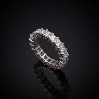 Handcrafted 18K white gold Diamond Eternity Band with 20 Princess Cut Diamonds totaling 4.88 Carat. Made to order based on finger size.