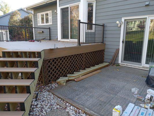 Tore out tread boards and replaced them with composite decking, including skirting for the sides of deck and stairs.