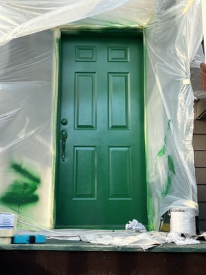 Front door being sprayed after body got done being sprayed