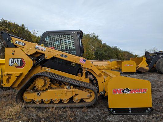 Tracked skid steers from Cat, Bobcat, and Yanmar, with all kinds of attachments