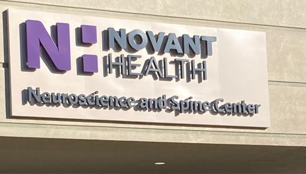 Sign on the front-facing of building housing Novant Health Neurology and Sleep (Suite 120)