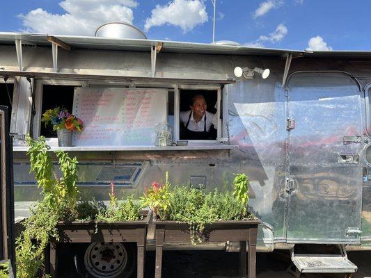 Owner welcoming customers