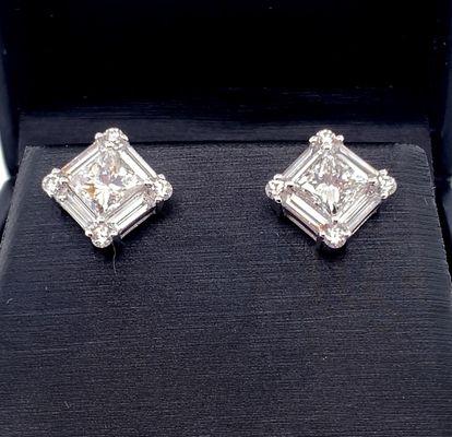 Princess cut diamond earrings with baguettes and brilliant cut rounds in the corners