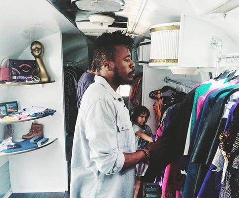 Customers shopping in our mobile vintage clothing store.