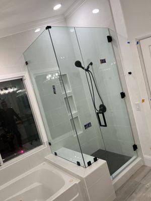 Frameless shower door sold and installed by us.