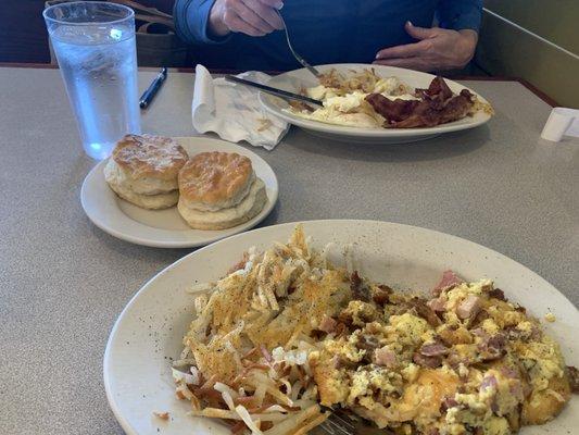 3 meat scramble and 2 eggs w/ bacon and biscuits.