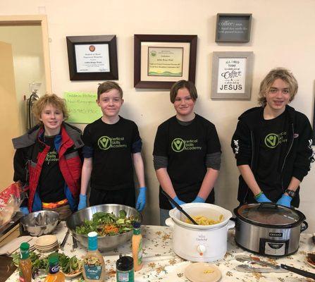 Middle school serves lunch to those that are less fortunate for their end of unit experience.