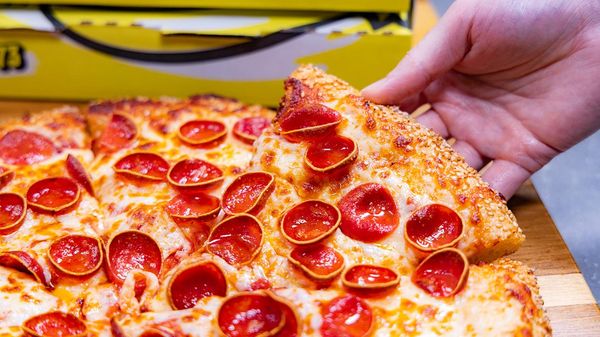 Celebrate 50 Years of Flavor with the '73 Classic, featuring 73 slices of savory pepperoni, gooey cheese, and a crispy crust!