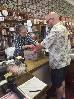 My husband, Chris and Patty taping up our boxes of treasures