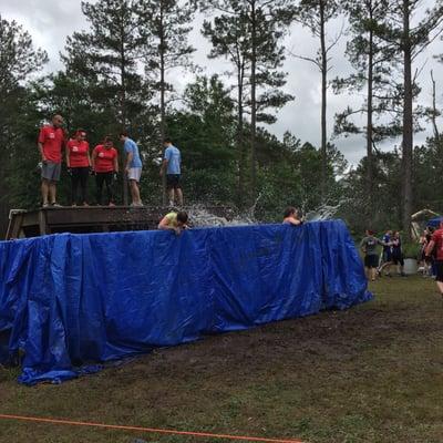 Yes you get to jump into a dumpster full of water