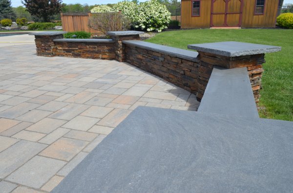 Sitting Wall, featuring natural stone facing with blue stone capping.