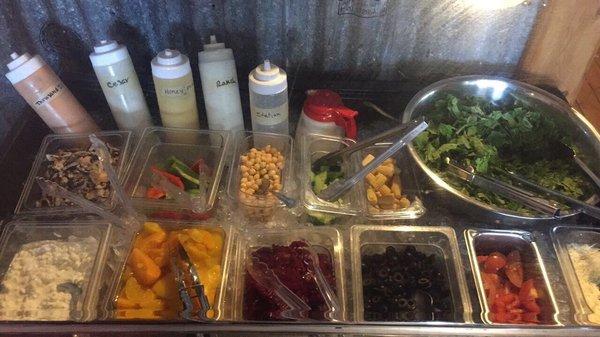 Salad bar with dressing in a bottle! Makes it convenient