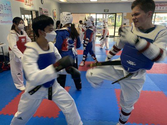 Sparring class with the black belts! All students use safety equipment during sparring.