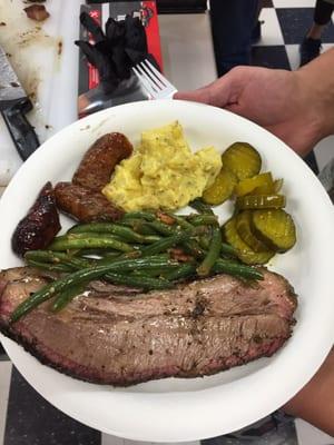 Brisket, sausage, green beans, potato salad and pickles.