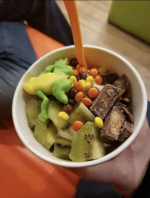 Pistachio and Reese group with kiwi, Reese's pieces and Reese's peanut butter cups, topped with a frog