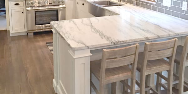 Farmhouse style kitchen with custom marble counter tops from Granite Accents.