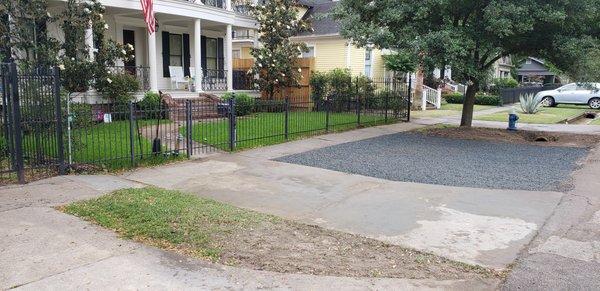 Houston Heights street parking with culvert pipe and black star gravel