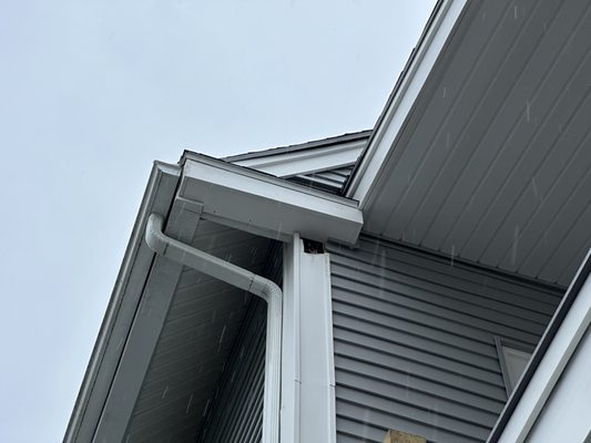 hole left in the vinyl siding from where they tried to install the roof the first time.