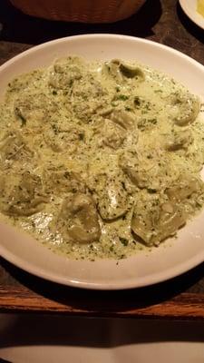 Tortelloni with a pesto cream sauce.