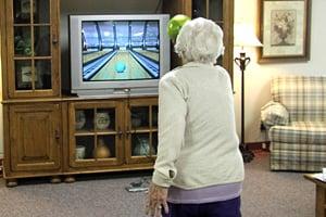 A Farmington Presbyterian Manor resident helps keep her mind and body sharp by playing Wii.