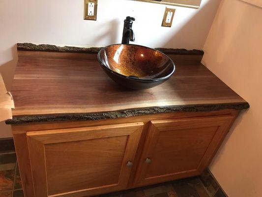 Handmade walnut counter top with bark showing