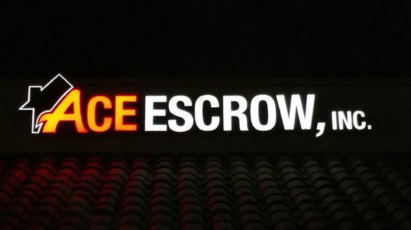 Ace Escrow sign at night~