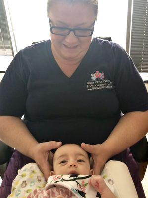 Our daughter during an adjustment...did you know cranial work is tied to gut health? It can make a big difference for little ones.