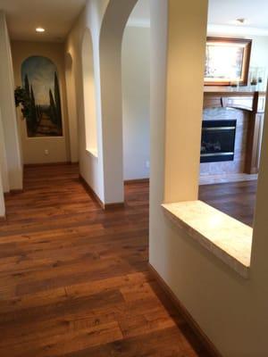 French White Oak Terra Cotta with uv cured oil and new baseboards stained, finished, and installed to match.