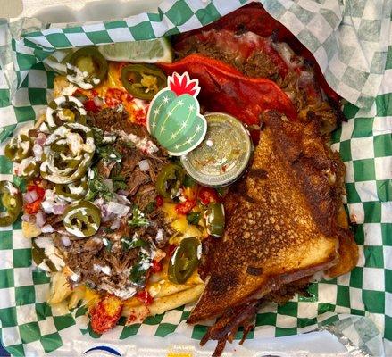 Birria sampler. 2 tacos, 1/2 grilled cheese and the loaded fries