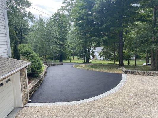 Paved driveway and installed Belgian block