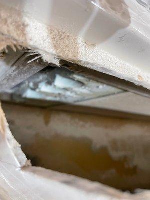 cut open the nose air dam looking down into the camper wall seeing the unfinished camper exterior wall and insulation