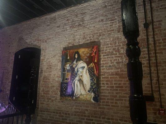 Interior royal art and exposed brick walls