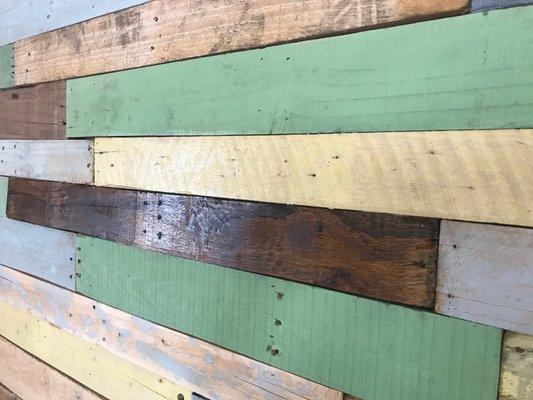 Custom painting and repurposing of pallets to create a wall inside a coffee shop in St. Thomas, USVI