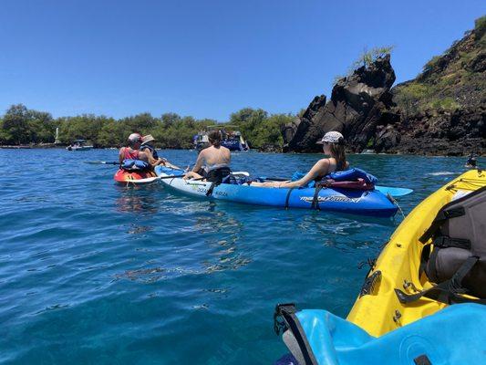 tying kayaks together and taking turns snorkeling