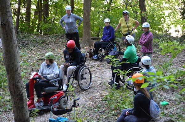 A small group of members from the Spinal Cord Injury Association of Illinois enjoying the outdoors.